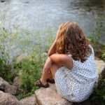 woman sitting near a lake bipolar signs and symptoms bipolar disorder treatment facilities percocet abuse